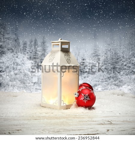 desk of white snow and white retro lamp with red balls