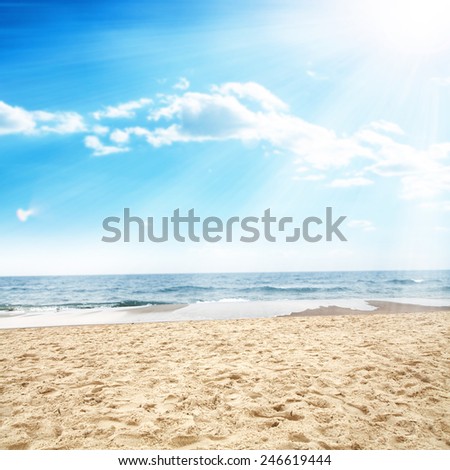 landscape of ocean and sun on sky with free space on sand