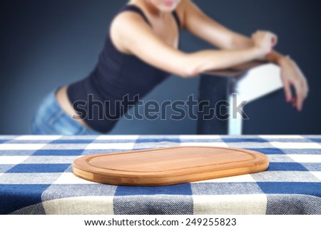 young woman of slim body and desk