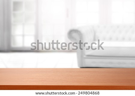interior of big window and white couch and red board