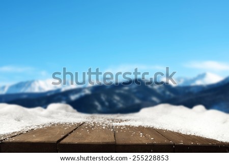 wooden table of snow