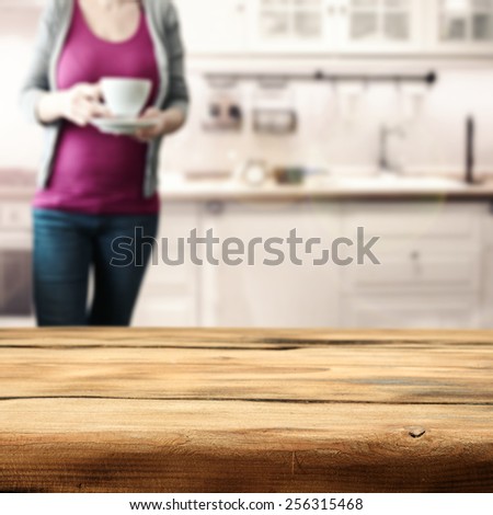 wooden desk interior of kitchen and woman at morning time