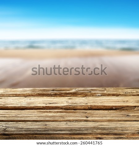 worn old pier and summer sea