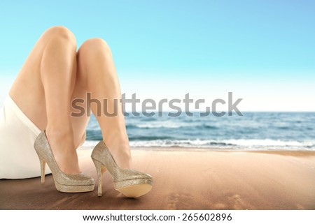 wet sand of summer beach and legs