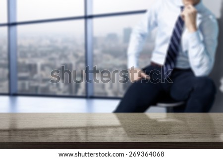 interior of office with big window and town landscape and dark desk space