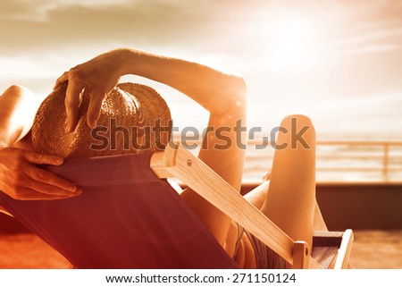 summer photo of woman on chair and beach with sea