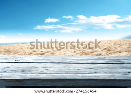 blue desk top and sand