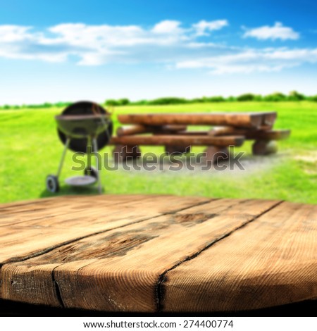 worn old table and grill and sky of blue color of summer time