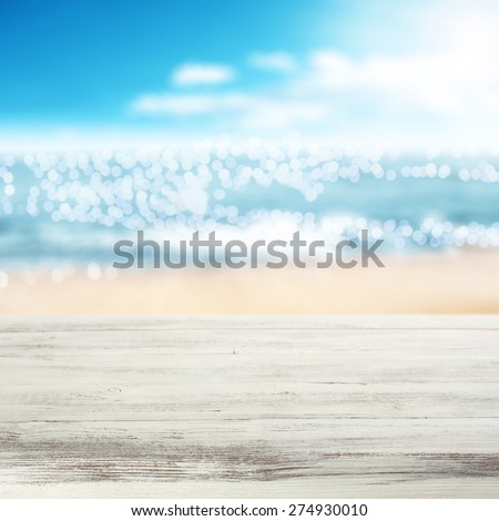coast of sea in blurred background and white desk
