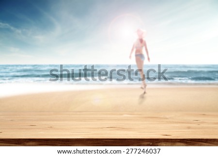desk of yellow space and woman on sand