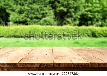 wooden space and green garden space of grass