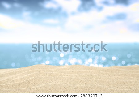 summer sand sea and blue sky in blurred background