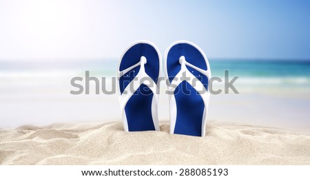 blue shoes yellow sand and sea