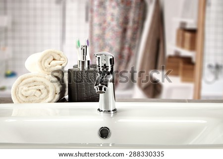 white towels soap and sink in bathroom