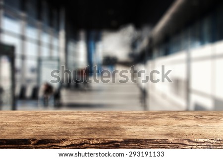 blurred background of gray color and brown desk space and free space for you