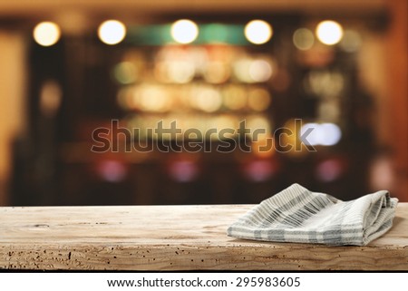 blurred background of bar and desk of wood and napkin