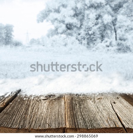 worn gray winter desk space and snow on top