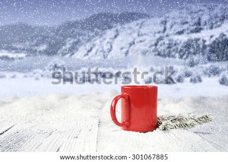 red mug snow and space for your decoration