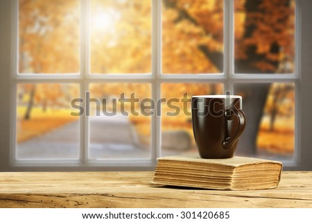 autumn window of sun light and brown mug