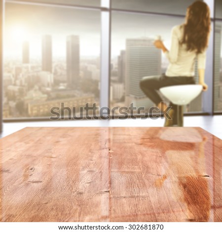 blurred background of woman on chair with blue window of sun and big red board for your space