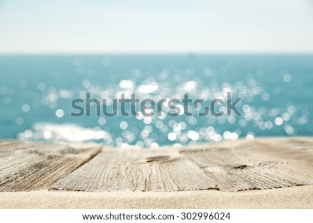 blue color of sea sand and gray wooden desk space