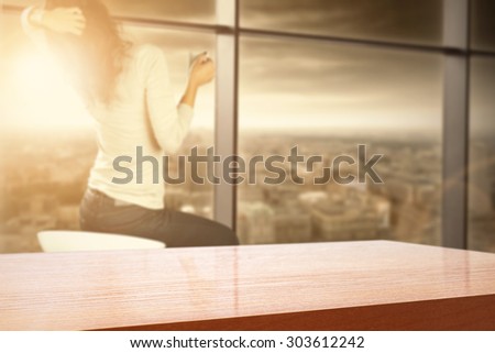 summer sunset on the sky big window of city landscape and woman on chair with lifestyle