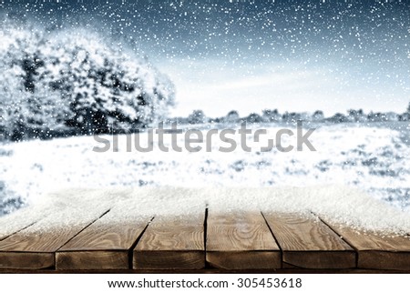 blue landscape of winter and brown wooden table of snow