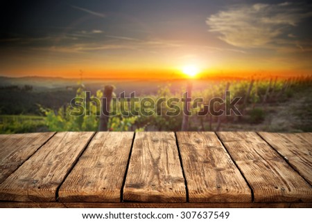 free space on wooden retro table and sunset