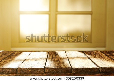 blurred background of window and sun light of morning sun with table
