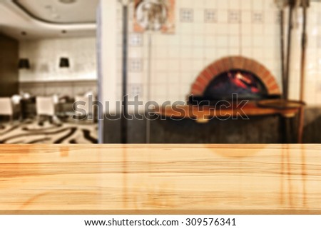 blurred background of fireplace and yellow glasses desk in restaurant interior