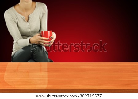 red desk top place and woman with red mug