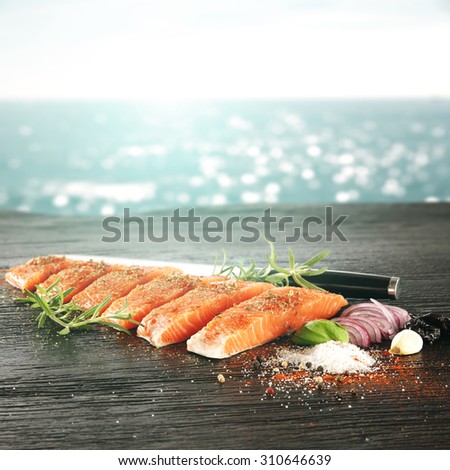 blurred background of sea and red meat of fish