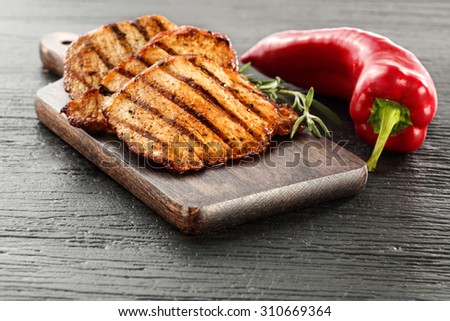 food of golden steak and vegetables of red color