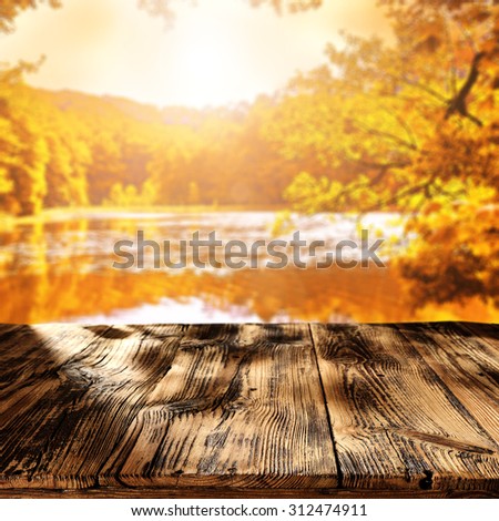 dark table and autumn lake place