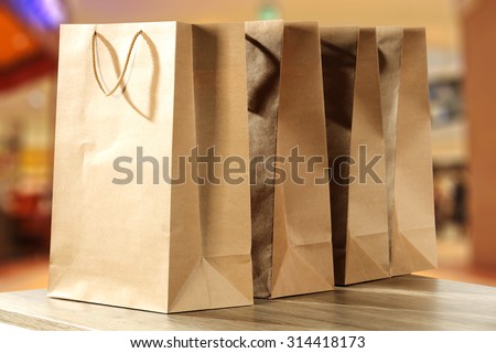 brown bags on wooden table and shop interior