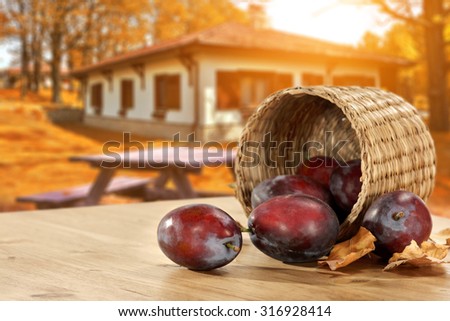 plums on the table  basket ring