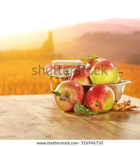 Autumn fruits in golden sunlight in table