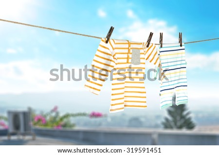 photo of roof and sky with dry clothes