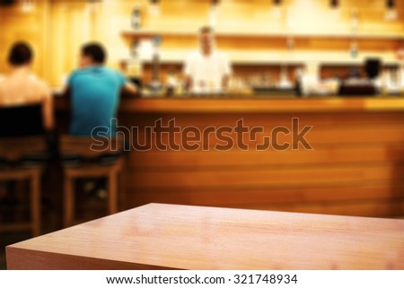 blurred background of bar and red cafe table