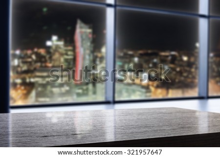blurred background of city at night and black decoration of desk top place