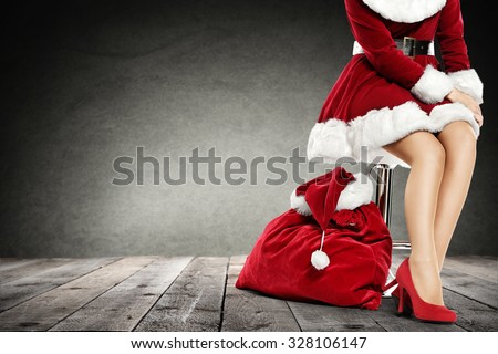 interior of dirty gray color with woman legs and santa claus sack of red color