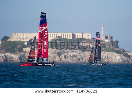 SAN FRANCISCO, CA - OCTOBER 4: Emirates Team New Zealand and Oracle Team USA sail in front of Alcatraz in the America\'??s Cup World Series sailing races in San Francisco, CA on October 4, 2012