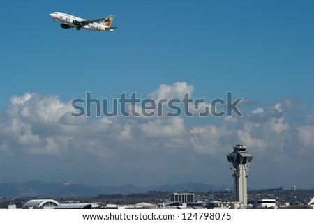 LOS ANGELES, CA - OCTOBER 23: A Frontier Airlines passenger jet takes off from Los Angeles International Airport (LAX) in Los Angeles, CA on October 23, 2012.