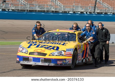AVONDALE, AZ - NOV 7 -Scott Lagasse\'s (11)pit crew pushes his car at the NASCAR Nationwide Series at the Phoenix International Raceway on November 7, 2008 in Avondale, Arizona.