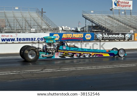 CHANDLER, AZ - OCTOBER 1: A dragster competes in the NHRA Pacific Division drag racing championship on October 1, 2009 in Chandler, Arizona.