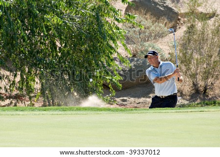SCOTTSDALE, AZ - OCTOBER 21: Tom Lehman hits out of a sand trap in the Frys.com Open PGA golf tournament on October 21, 2009 in Scottsdale, Arizona.