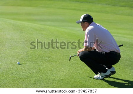 SCOTTSDALE, AZ - OCTOBER 22: Arron Oberholser lines up a putt in the Frys.com Open PGA golf tournament on October 22, 2009 in Scottsdale, Arizona.