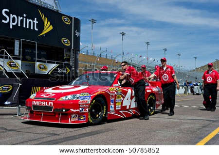 AVONDALE, AZ - APRIL 10: The pit crew pushes the #42 Target Chevrolet car, driven by Juan Pablo Montoya, onto the track before the start of the Subway Fresh Fit 600 on April 10, 2010 in Avondale, AZ.
