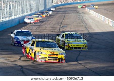 AVONDALE, AZ - APRIL 10: Clint Bowyer (#33) leads a group of cars into turn one at the Subway Fresh Fit 600 NASCAR Sprint Cup race on April 10, 2010 in Avondale, AZ.