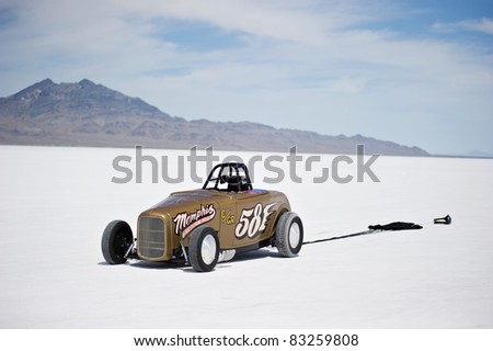 WENDOVER, UT - AUGUST 13: A 1938 Ford Roadster with its parachute deployed on the Bonneville Salt Flats during Bonneville Speed Week on August 13, 2011 near Wendover, UT.